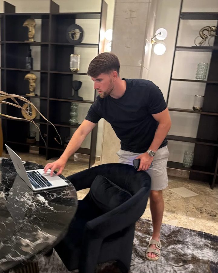 Conor Chapman at work on his laptop